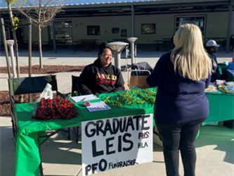 PFO members selling Leis at graduation