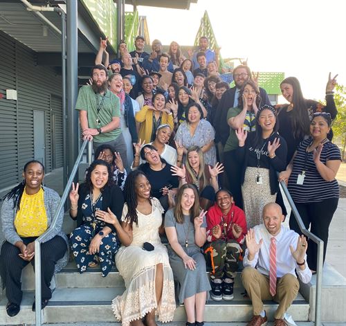 Teachers sitting on stairs